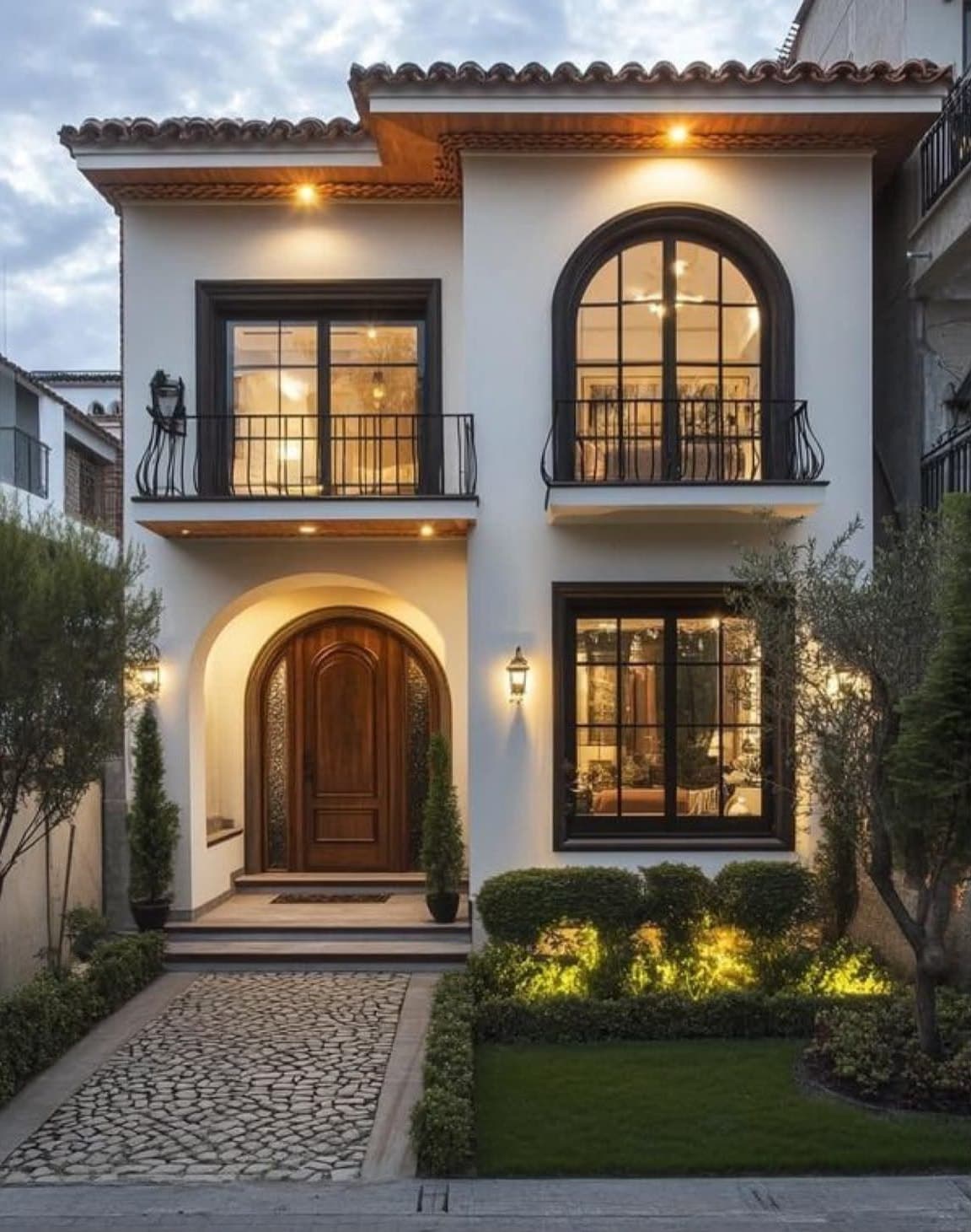 3D elevation of a white two-storey house with arched windows, a terracotta tile roof and an arched wooden front door